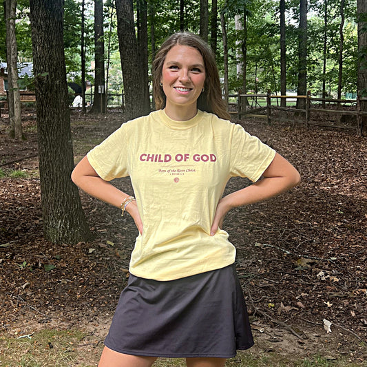 Woman wearing the Child of God tee in Butter