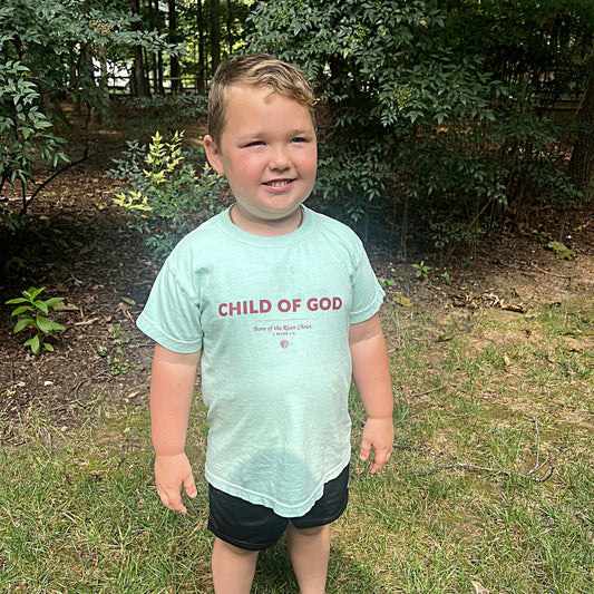 Child wearing the Child of God youth tee in Island Reef
