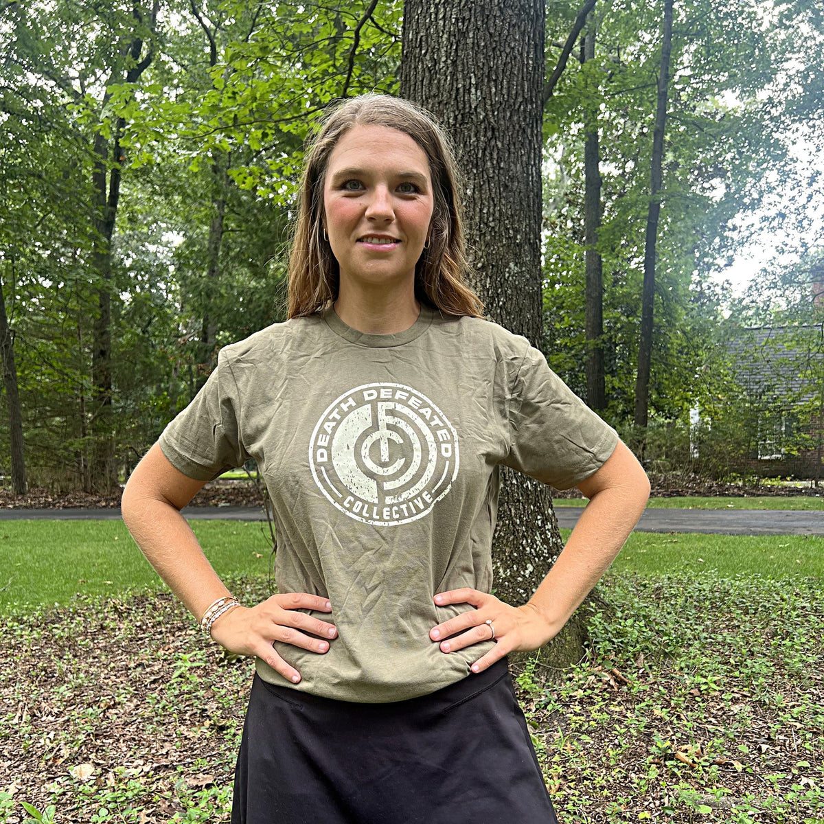 Woman wearing the DDC Logo athletic fit tee in Military Green