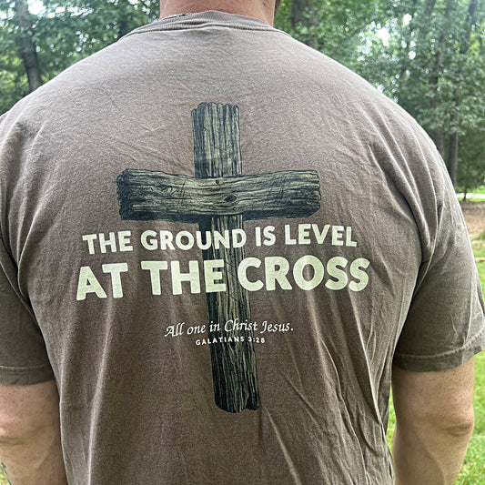 Back of the Level Ground tee reading The ground is level at the cross