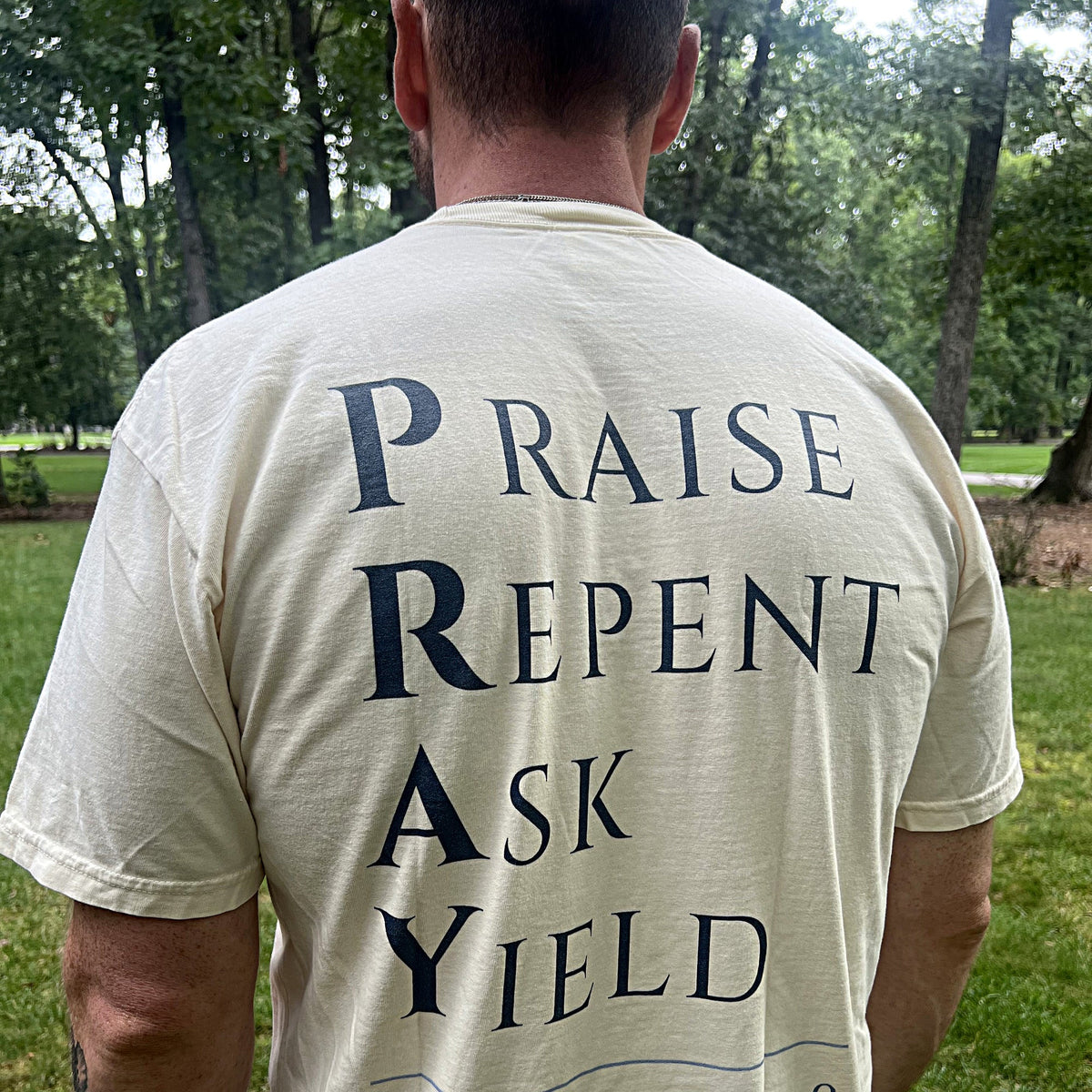 Praise Repent Ask Yield acrostic on the back of the Pray tee
